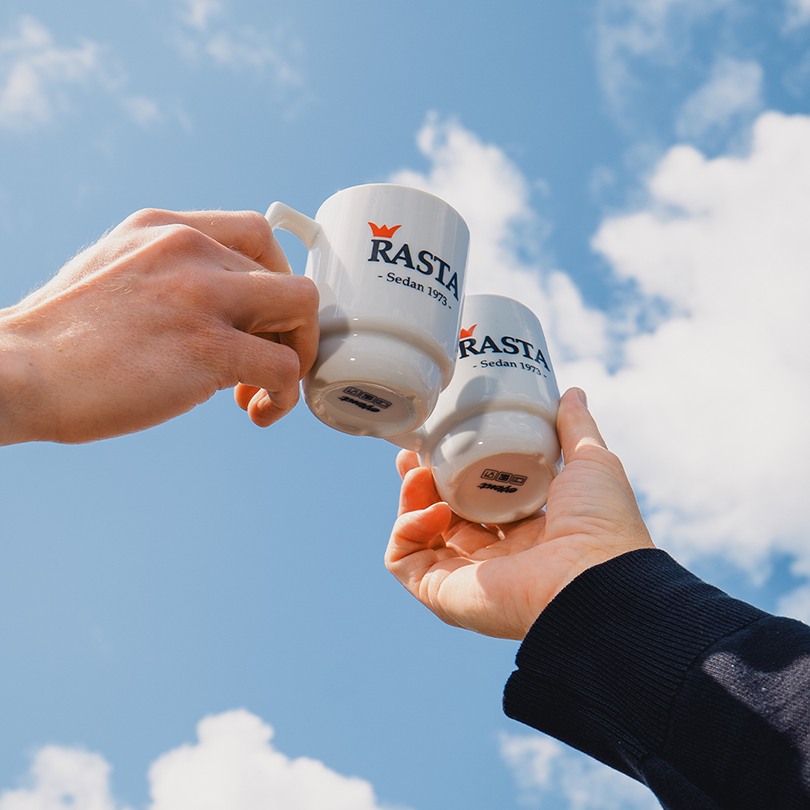 Two Rasta mugs against a blue sky