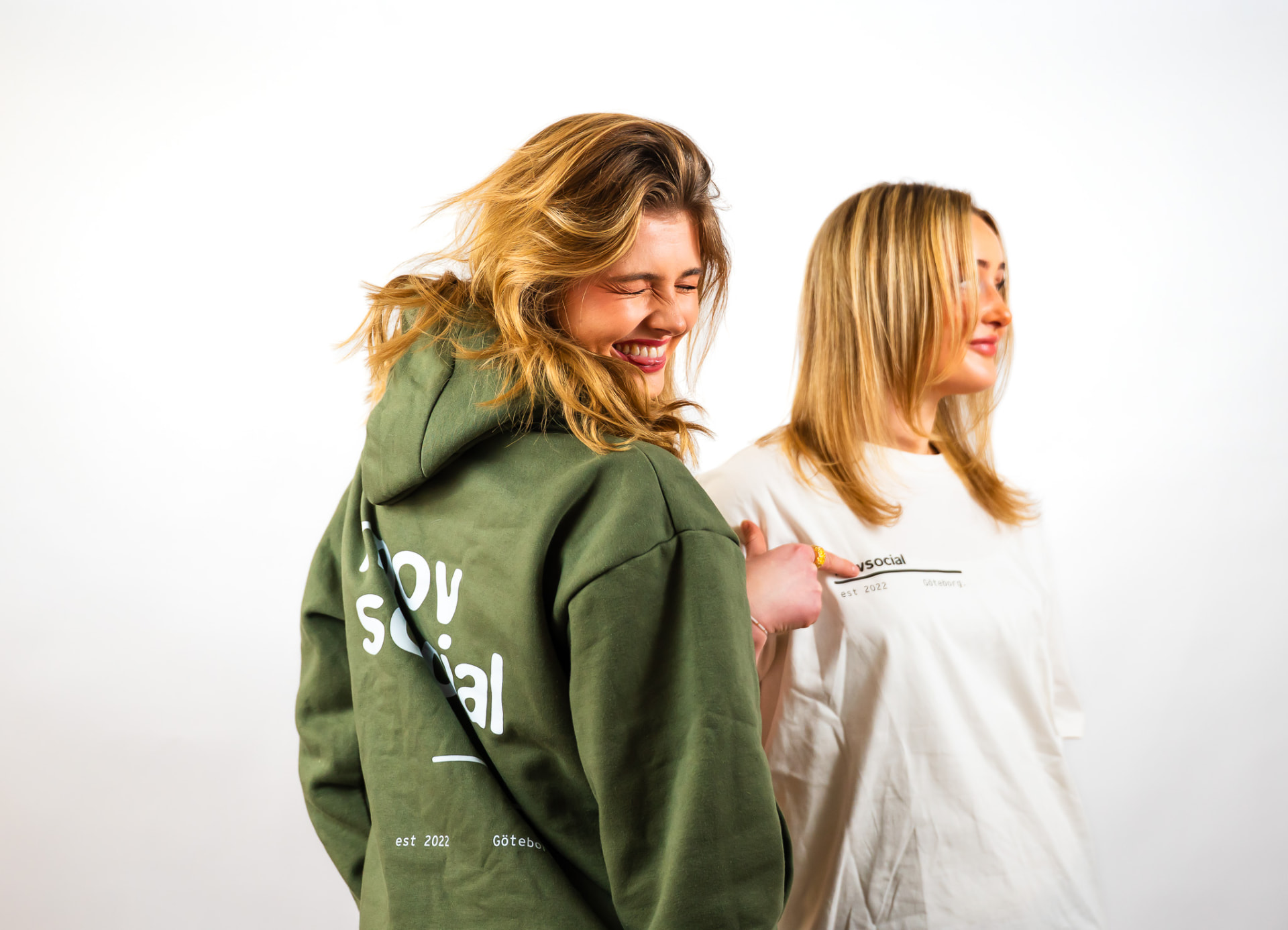 Movsocial olive hoodie back print worn in the studio