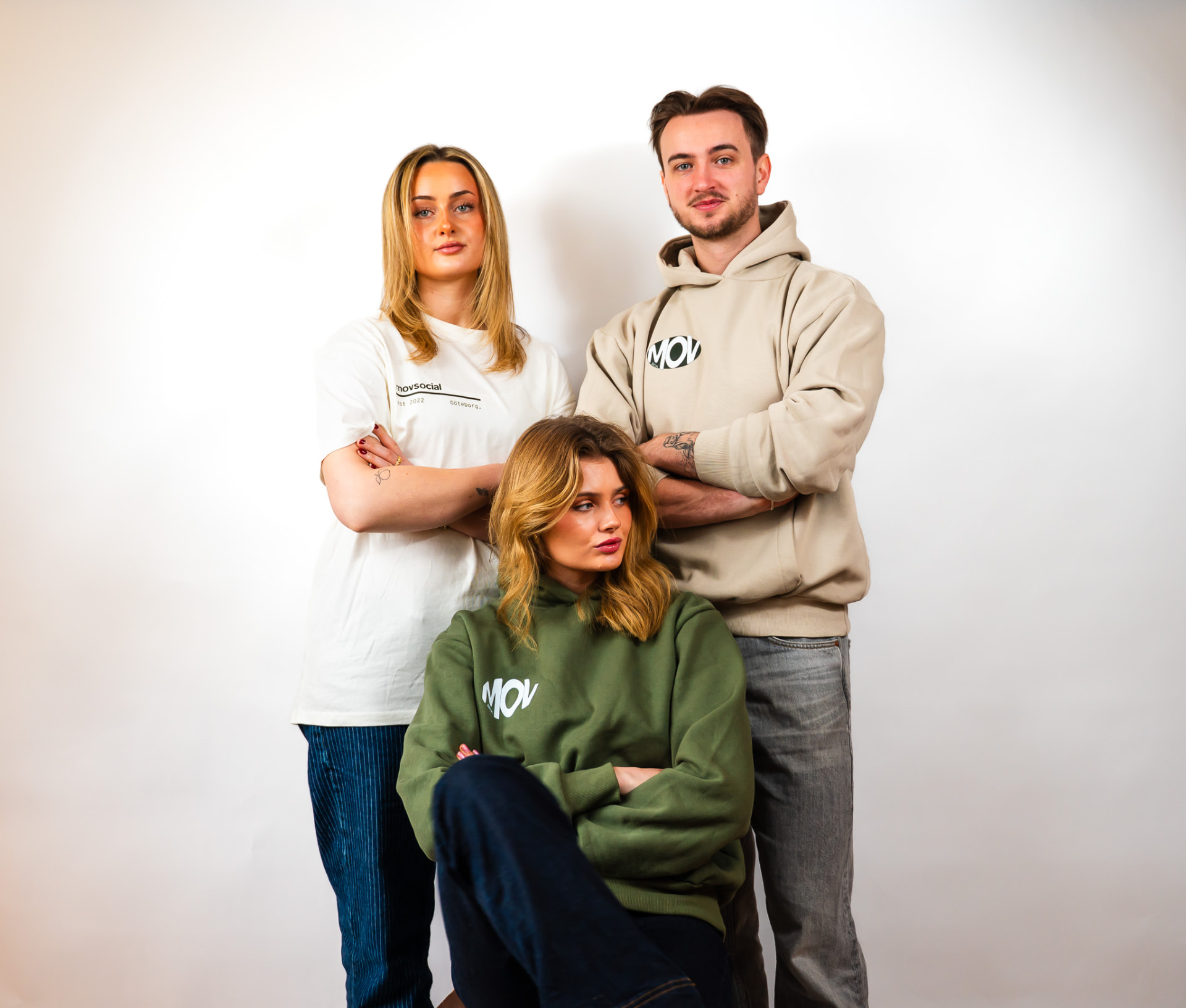 The Movsocial team wearing the hoodie and tee