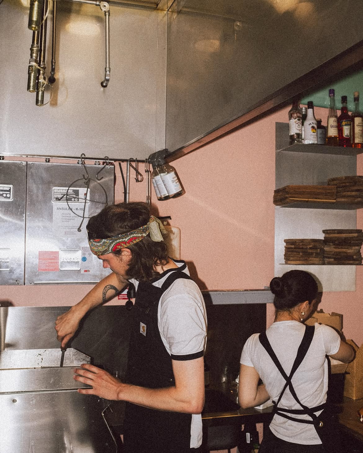 The kitchen team at work behind the pass