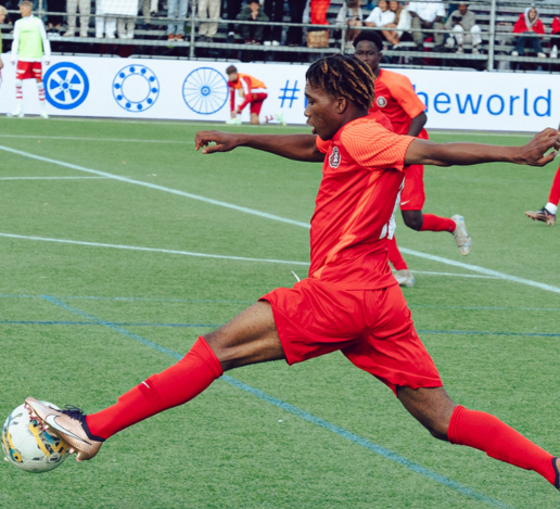 Gothia Cup player striking the ball during a match